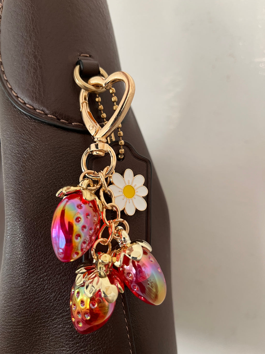 Red strawberry with daisy charm